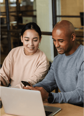 two people working at a computer