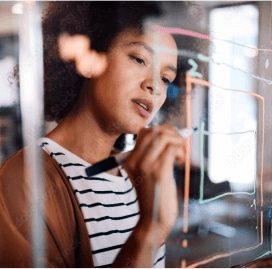 person writing on a glass whiteboard